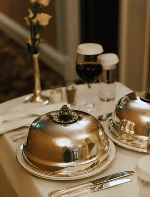 Covered meal is served on the table