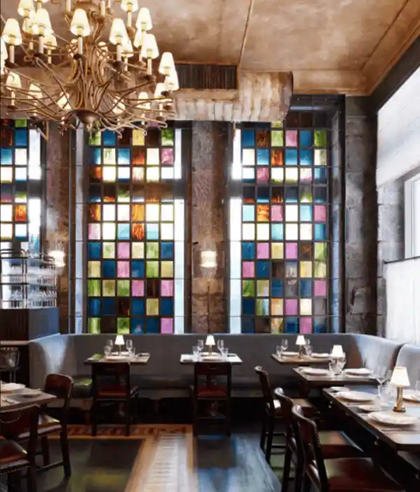 Dining table and chair lying just beside the large glass window