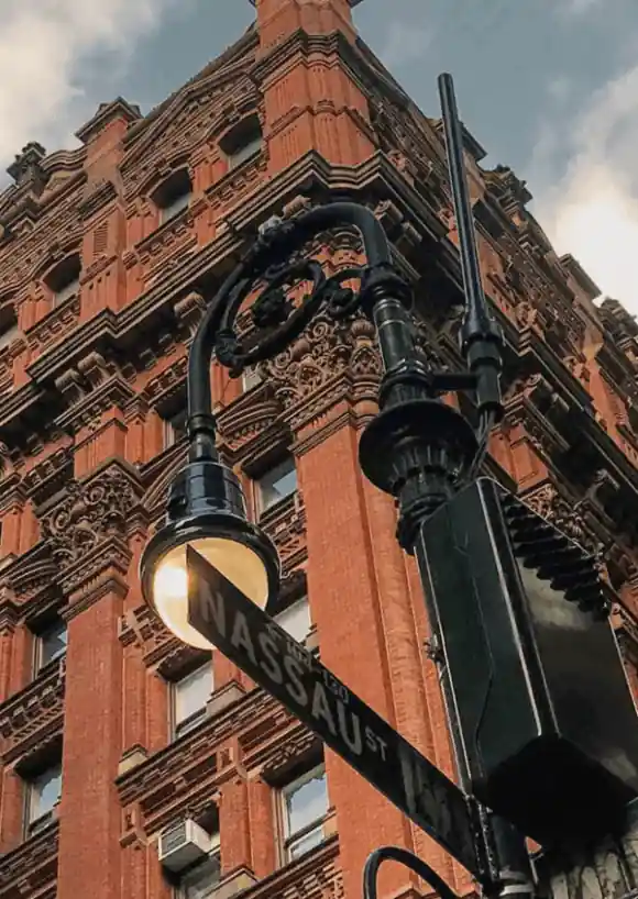 Signboard on the street lamp reads 